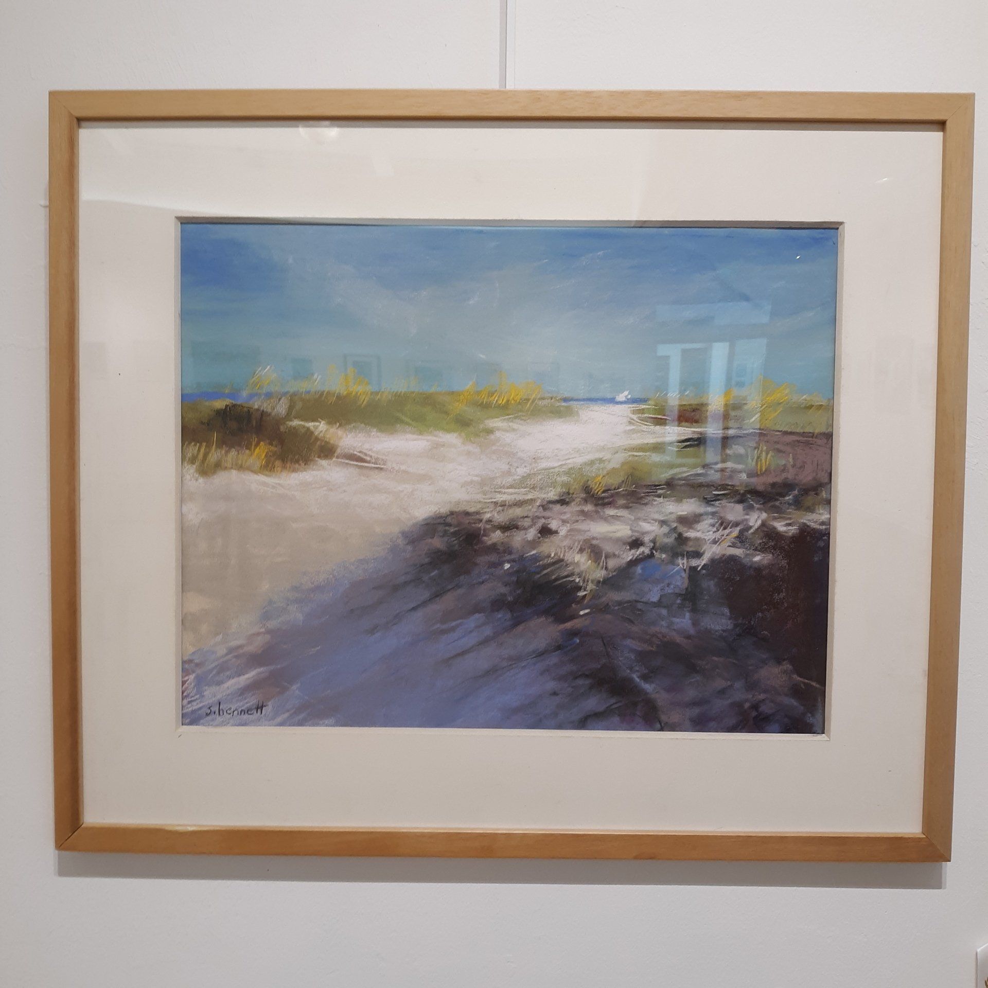 Coastal landscape painting, sandy path, blue sky, framed.