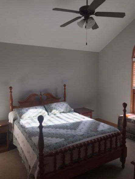 Bedroom with a Bed and a Ceiling Fan — Poland Township, OH — Donnadio Painting
