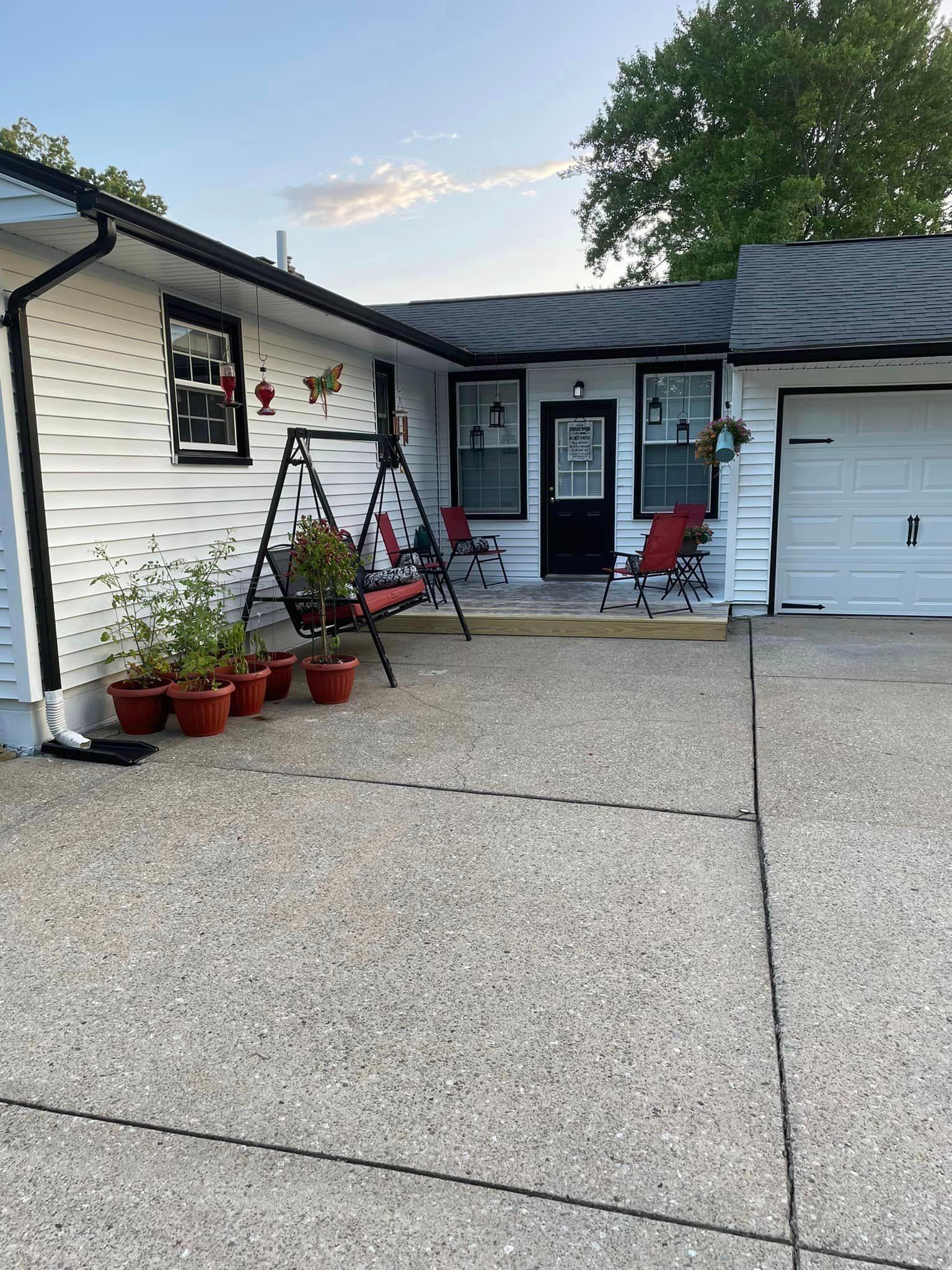 Front of a House with a Swing and Chairs — Poland Township, OH — Donnadio Painting