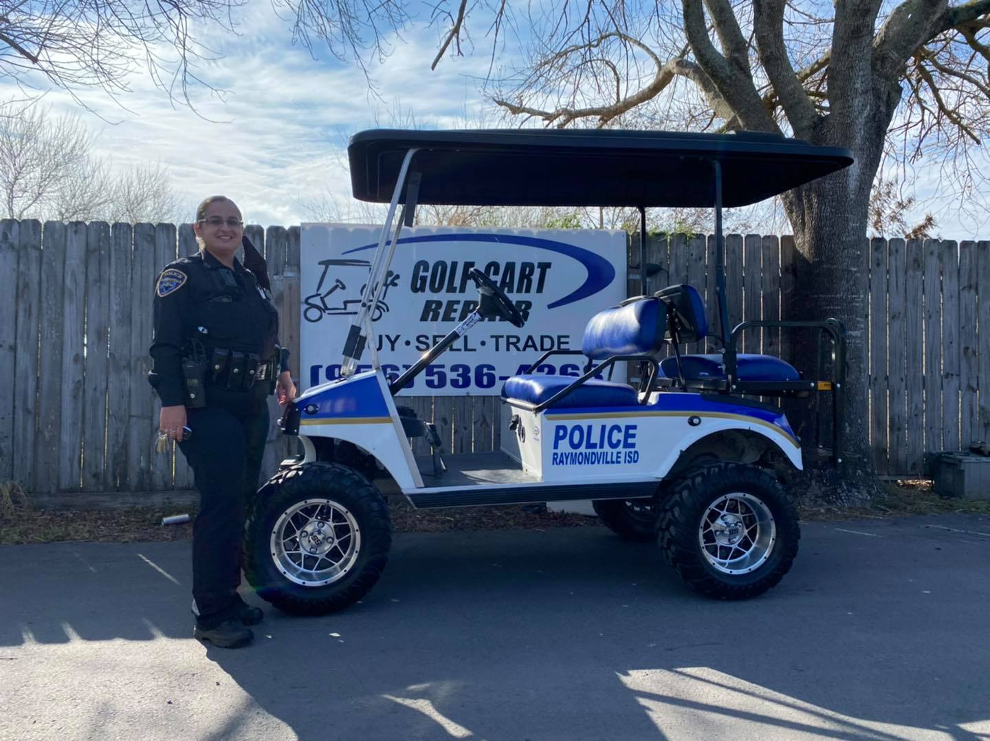 Woman Beside Police Golf Cart — Harlingen, TX — Golf Cart Repair Inc.