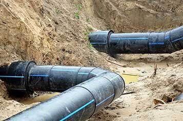 Two Black Plastic Bent Pipes  — Residential Septic Services in Naples and Collier County, FL