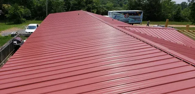 Red metal roof of a building.