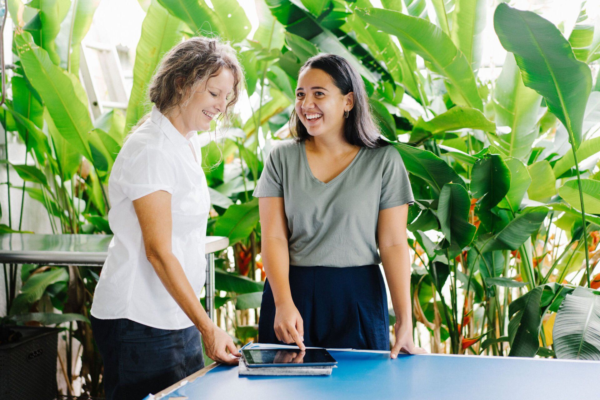 Two Women Are Standing Next to Each Other — Attention to Detail Cleaning Services & Deck Coating Darwin in Casuarina, NT