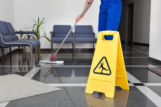A Person is Mopping the Floor — Attention to Detail Cleaning Services & Deck Coating Darwin in Casuarina, NT