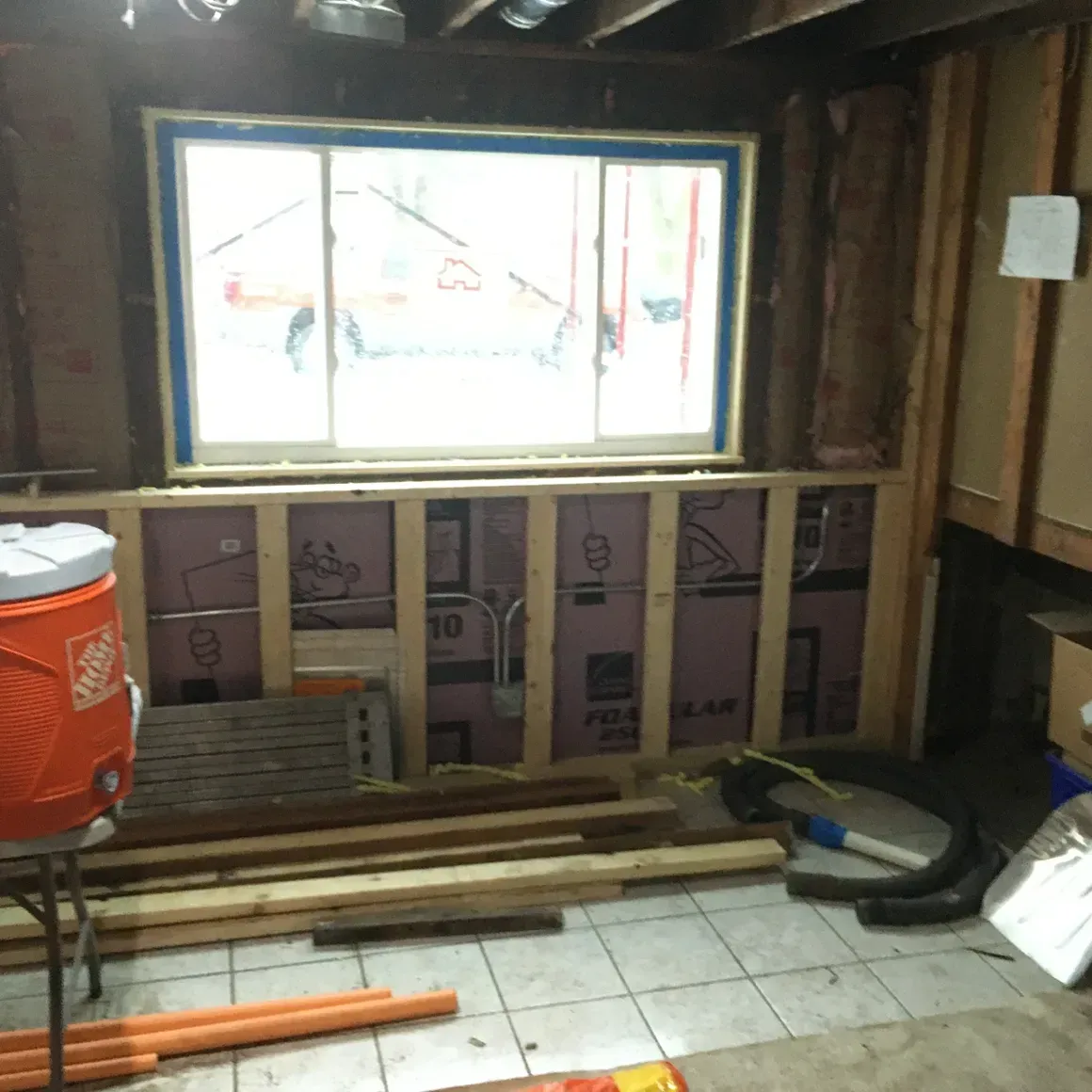 A room with a cooler that says home depot on it