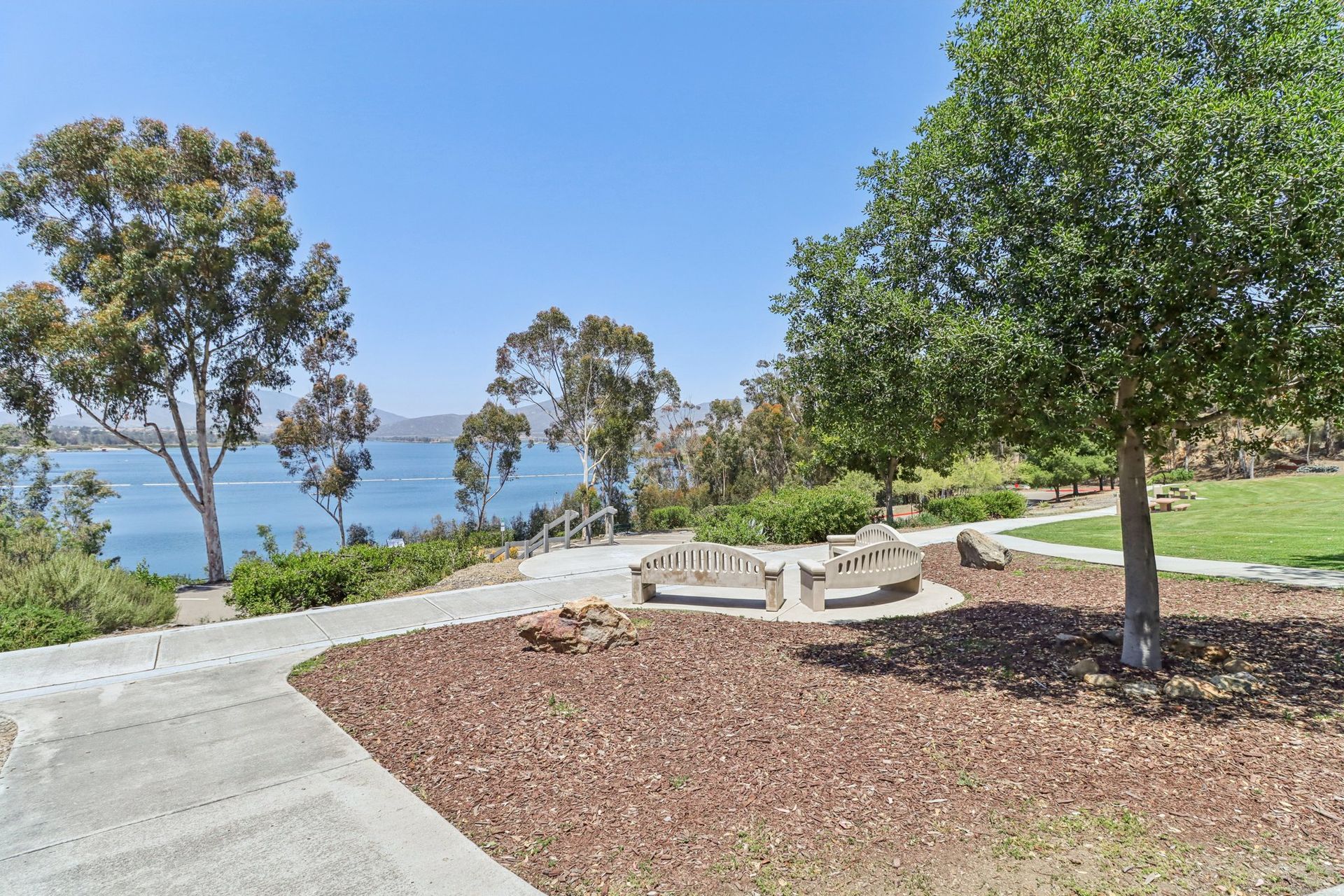 A park with a view of the ocean and trees
