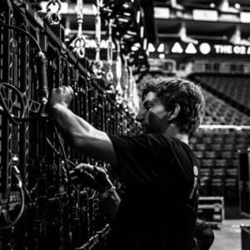 led screen backdrop installation technician connecting the equipment