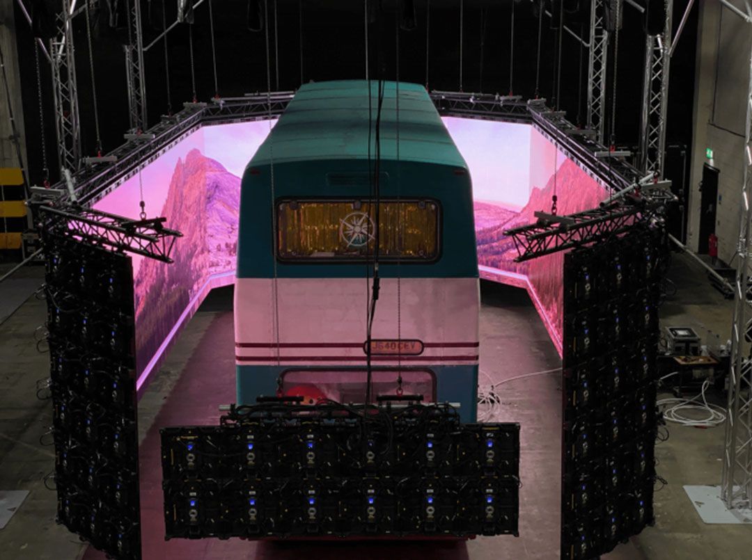 bus wrapped in LED screens to simulate travel and motion