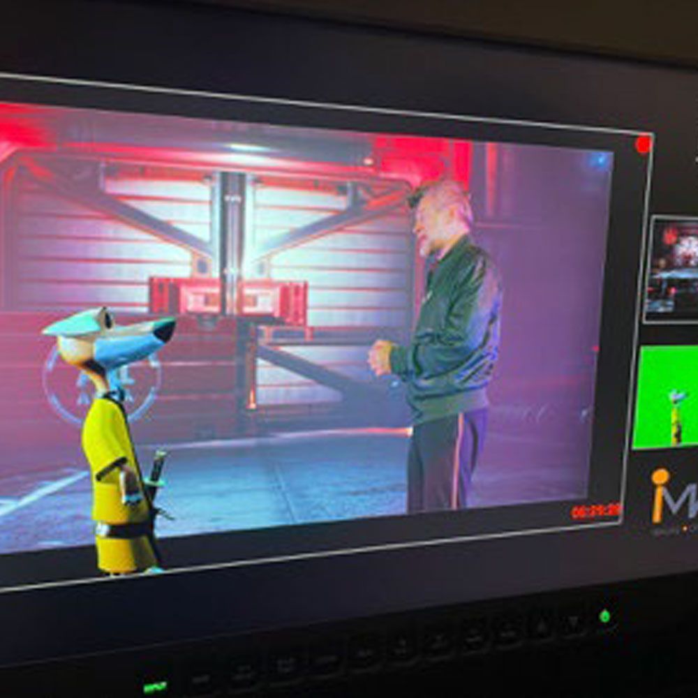 A man and a dog are talking on a computer screen