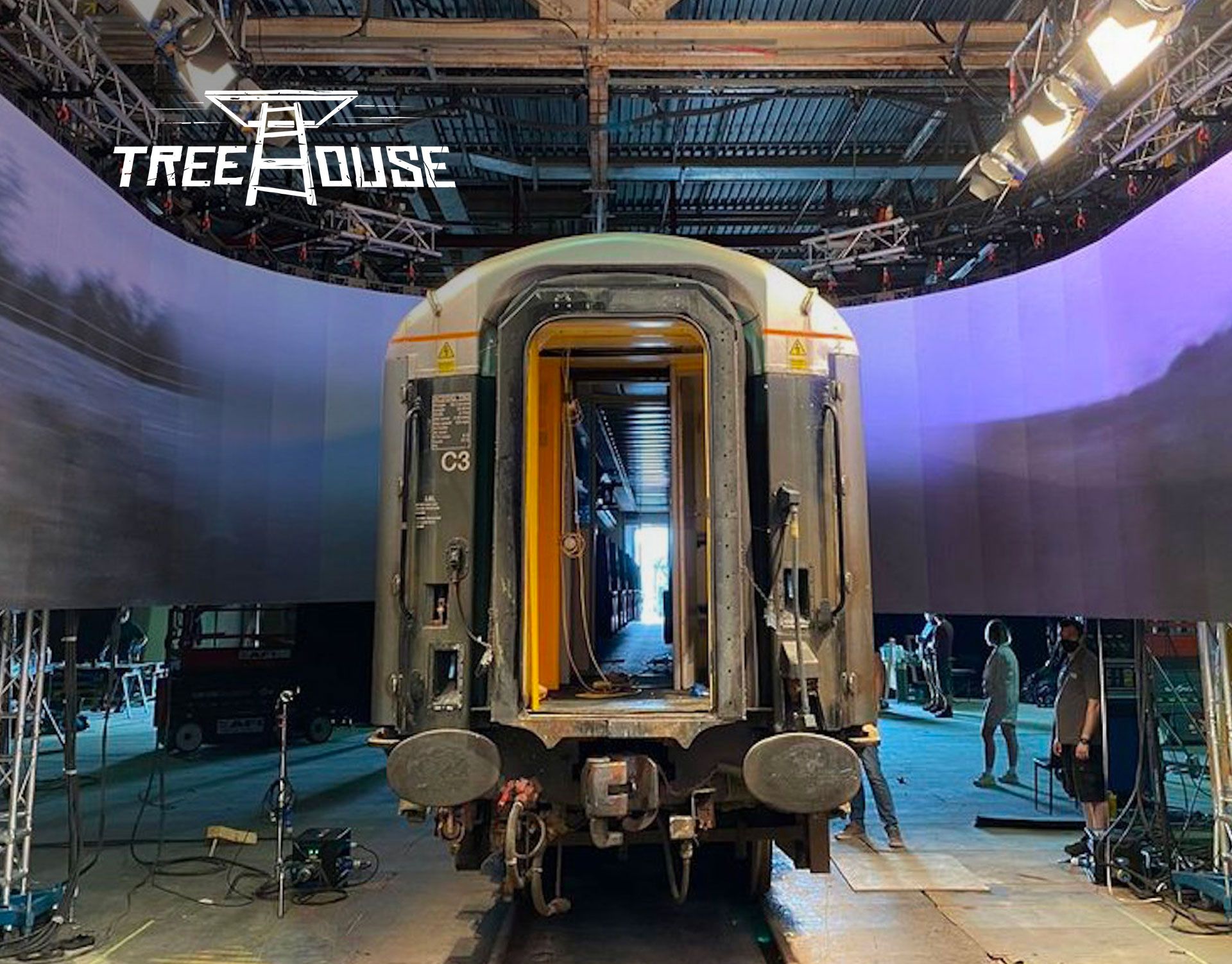 image of a full size train carriage in a studio with an LED wrap to simulate travel and movement outside the set