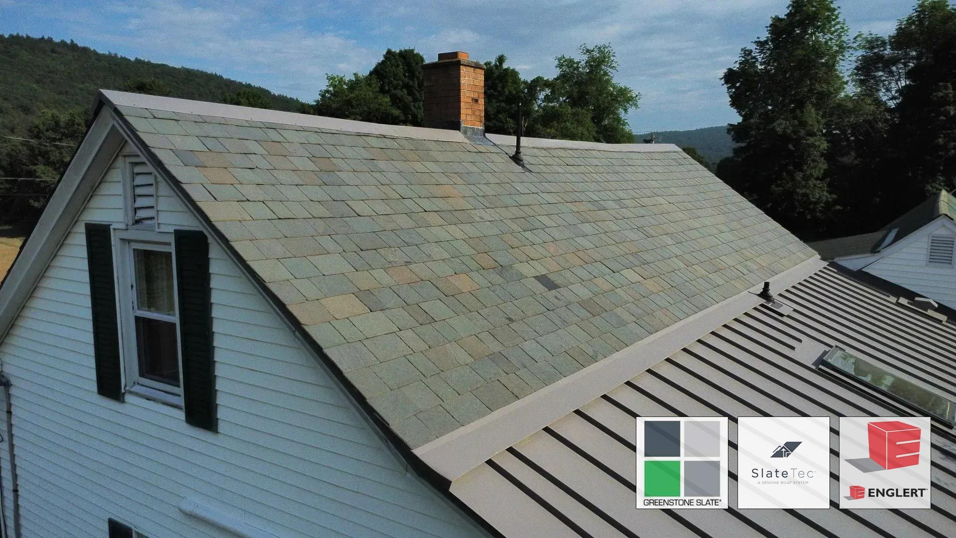 An aerial view of a house with a slate roof.
