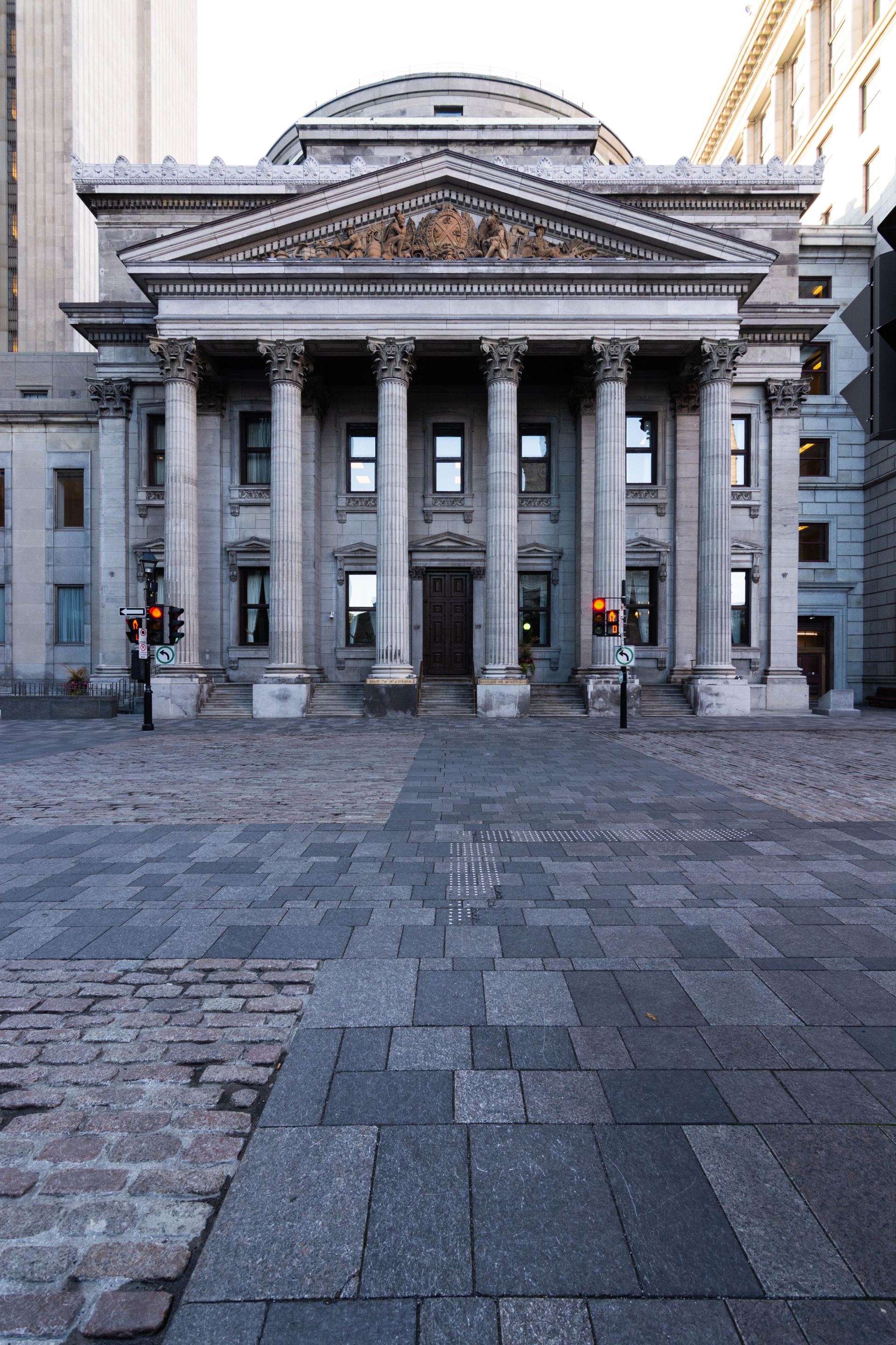 A large building with columns and a dome on top of it