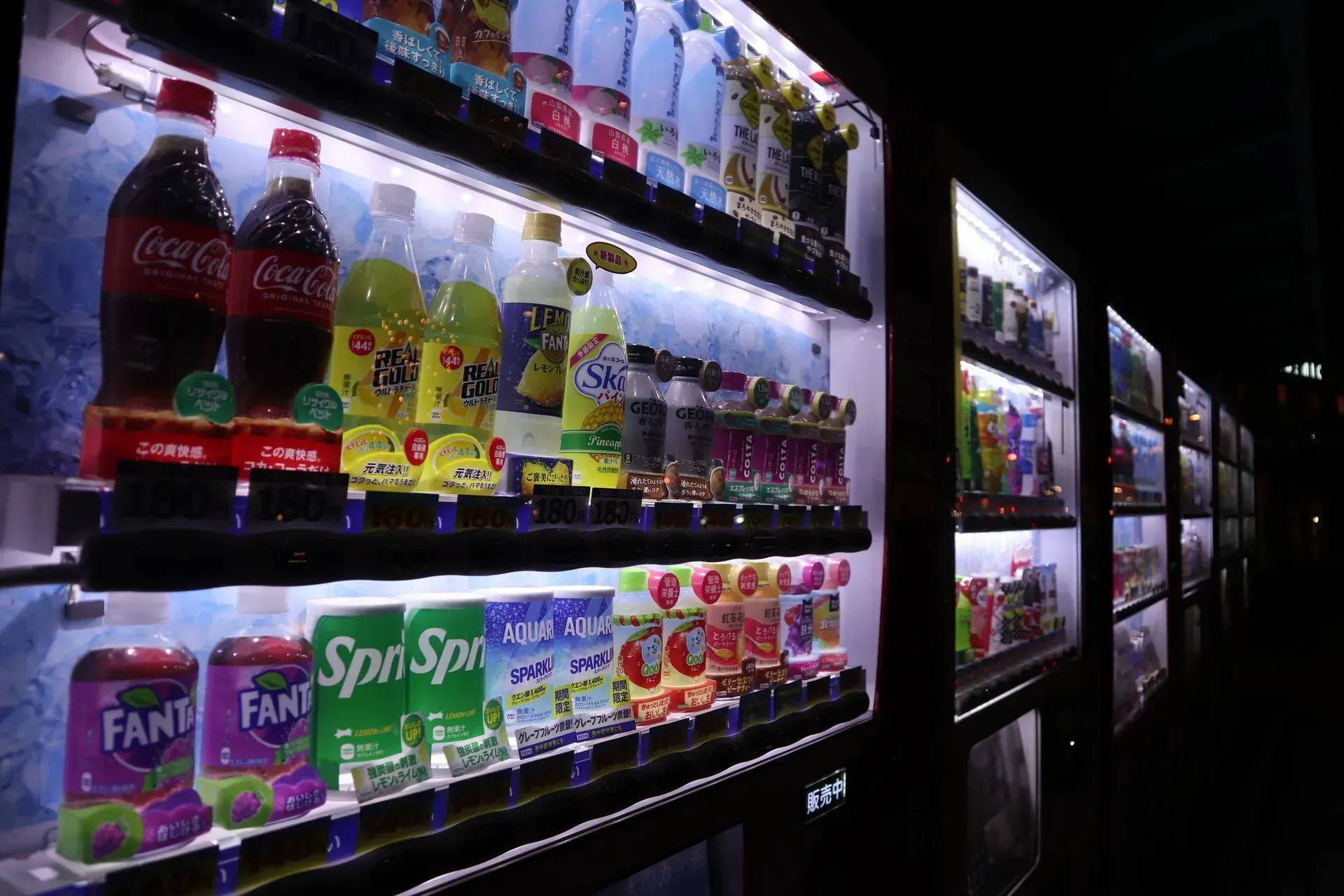 A vending machine filled with sodas including coca cola and fanta in Los Angeles, CA