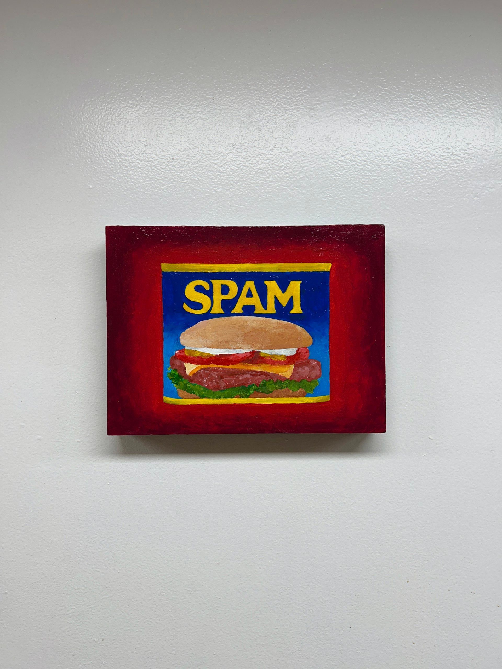 Painting of a Spam burger with the Spam logo on a red background.