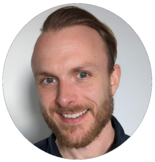 Headshot of Mike, a white man with a short beard, who is smiling at the camera 