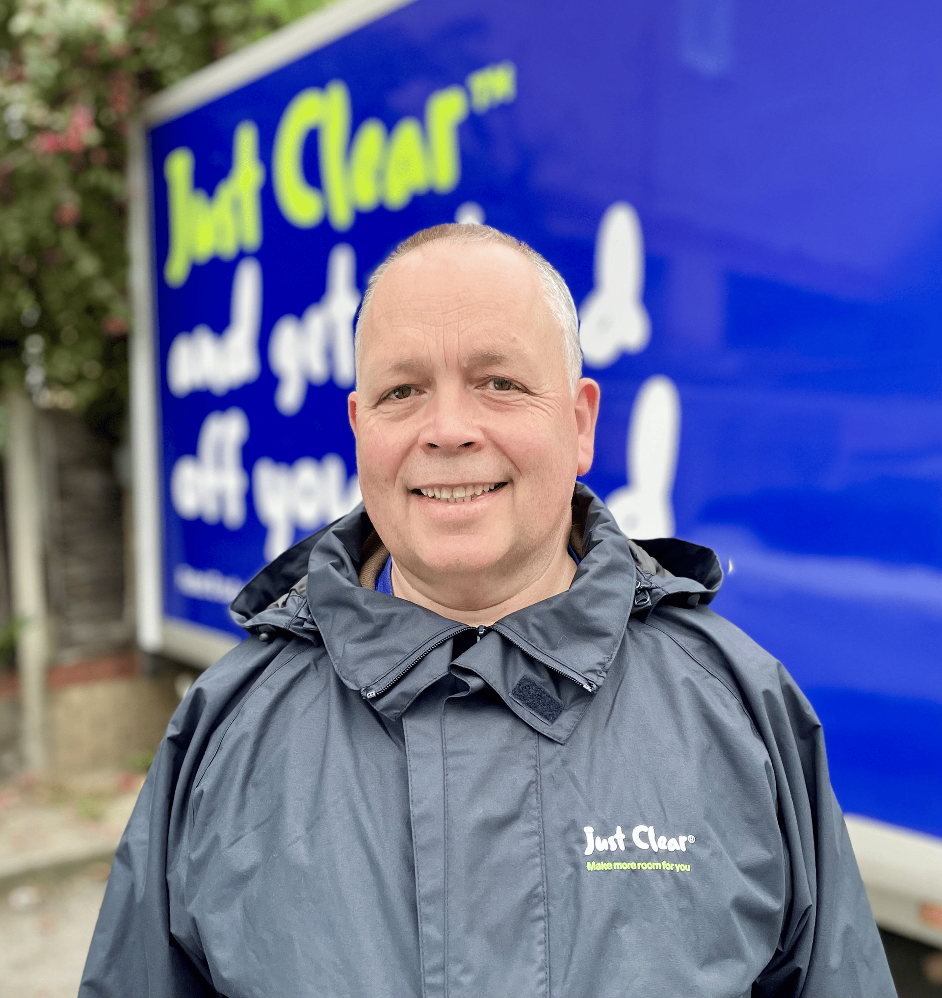  Euan Martyn, a white middle aged man, wearing a JustClear uniform, smiling into the camera