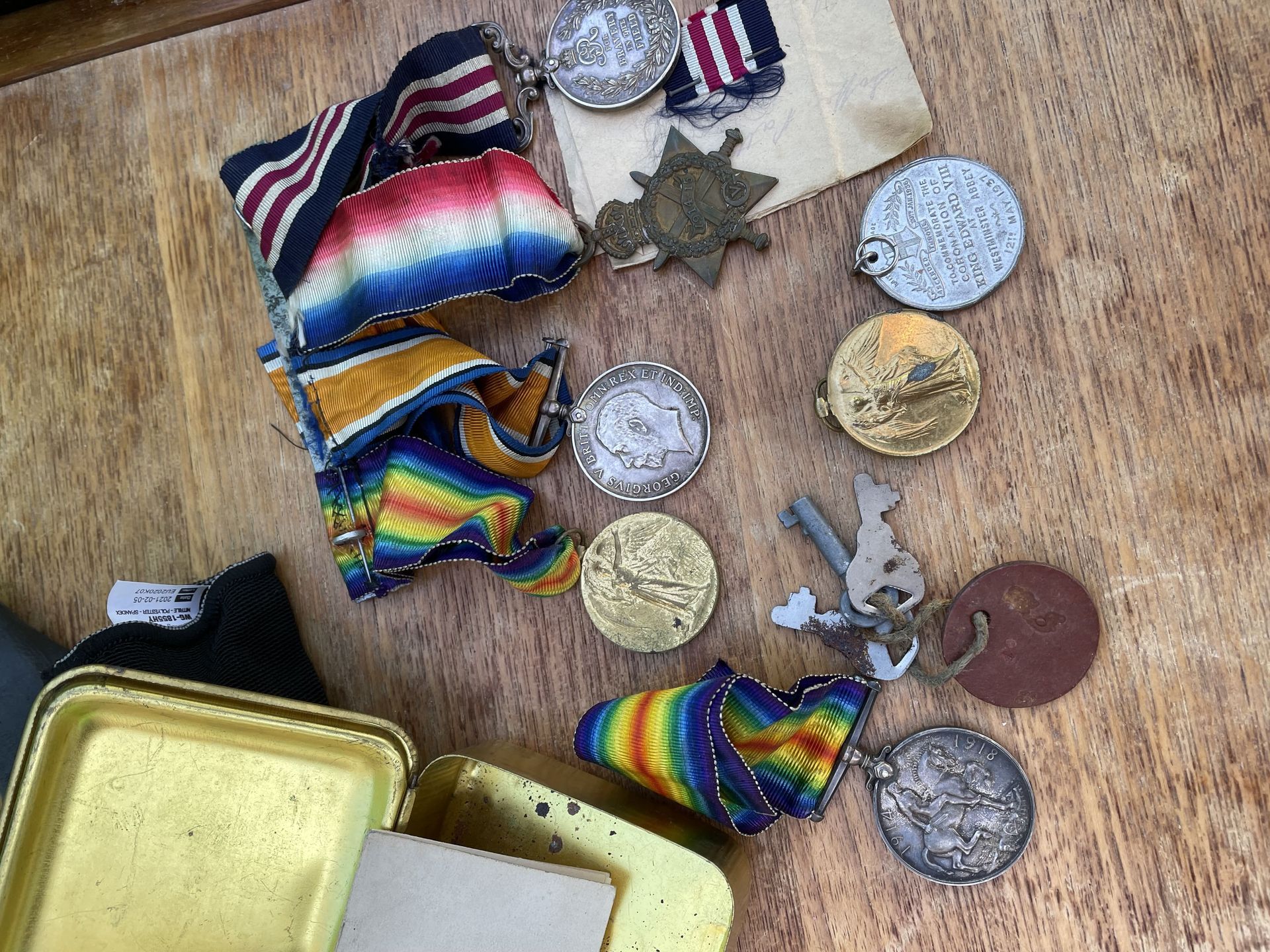 a selection of 8 medals from World War 1 , laid out on a table