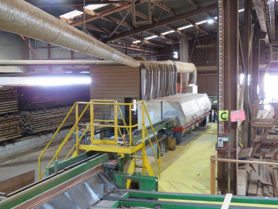 A Large Warehouse Filled With Lots of Wood and Machinery — Marshall Notaras Hardwoods Pty Ltd In Byron Bay, NSW