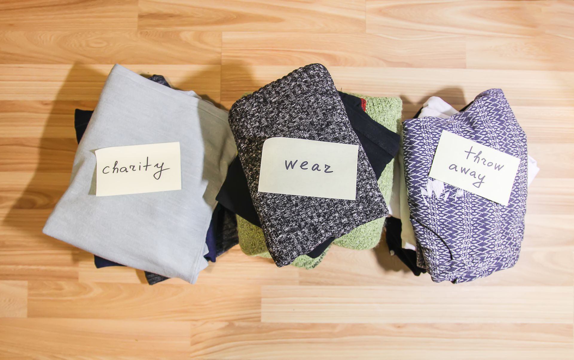 Piles of clothes labeled 