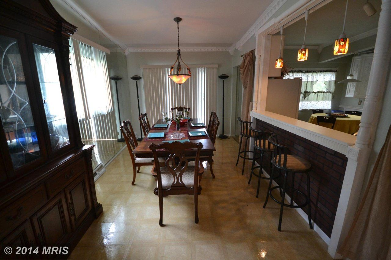 a dining room with a table and chairs in it