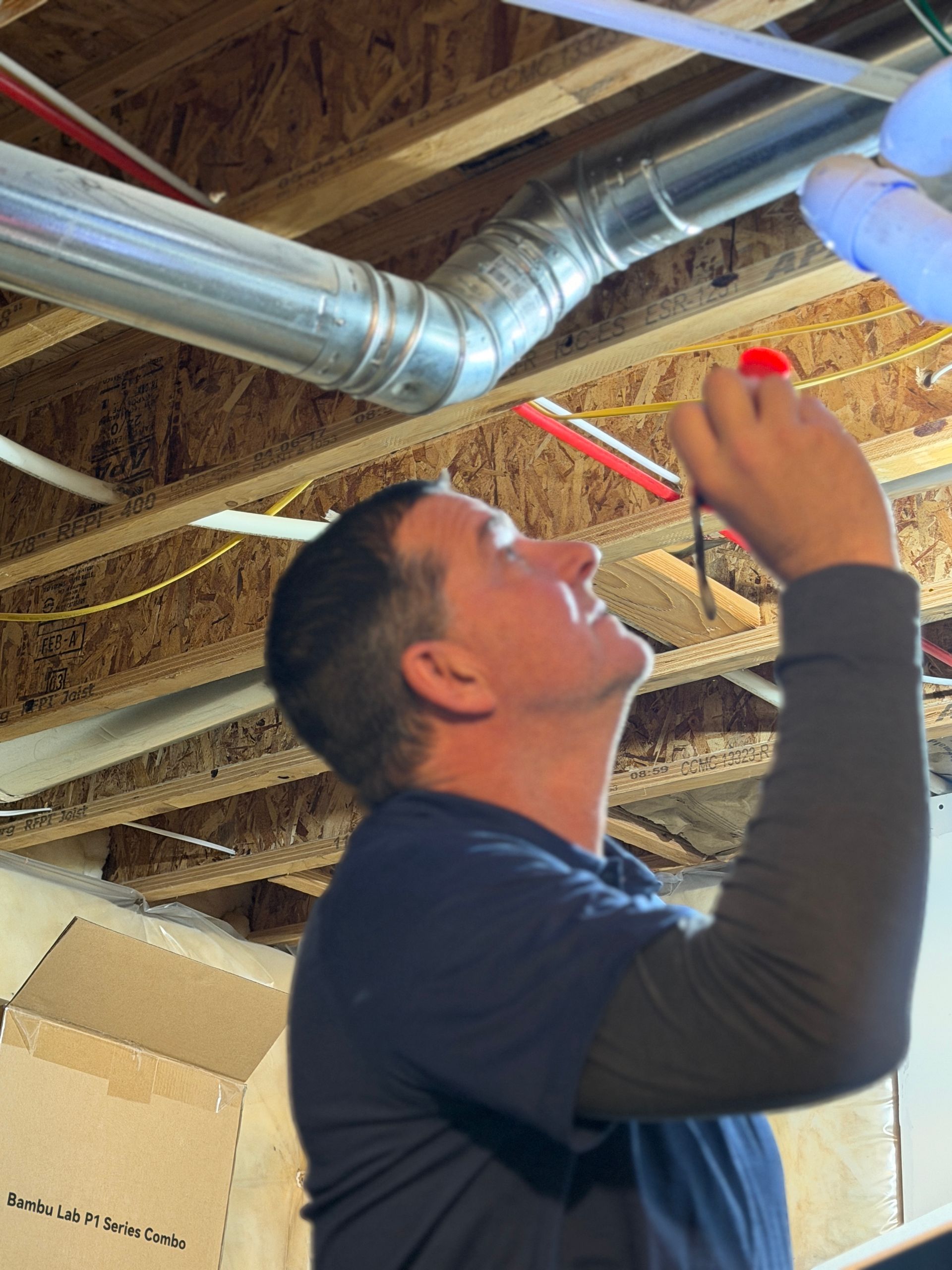 Public adjuster inspecting hot water heater
