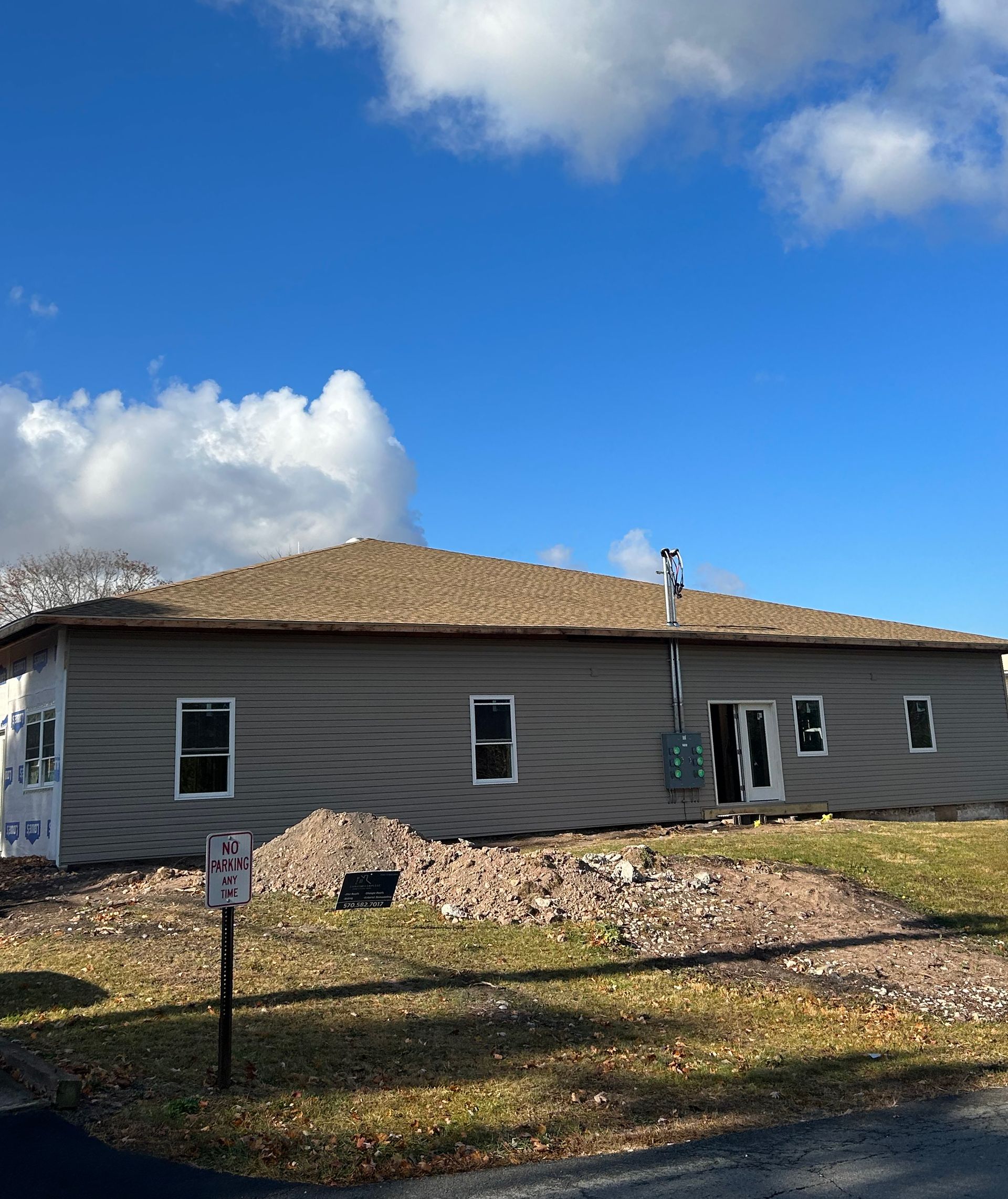 A house with a no parking sign in front of it