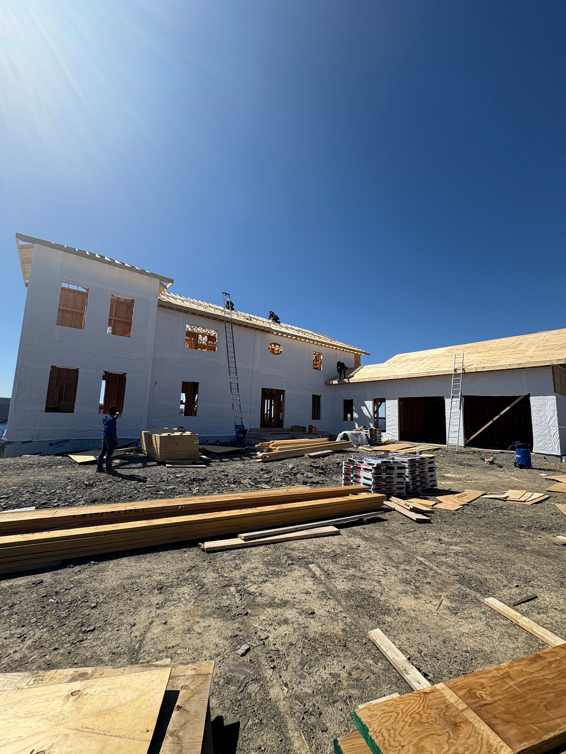 A large white house is being built