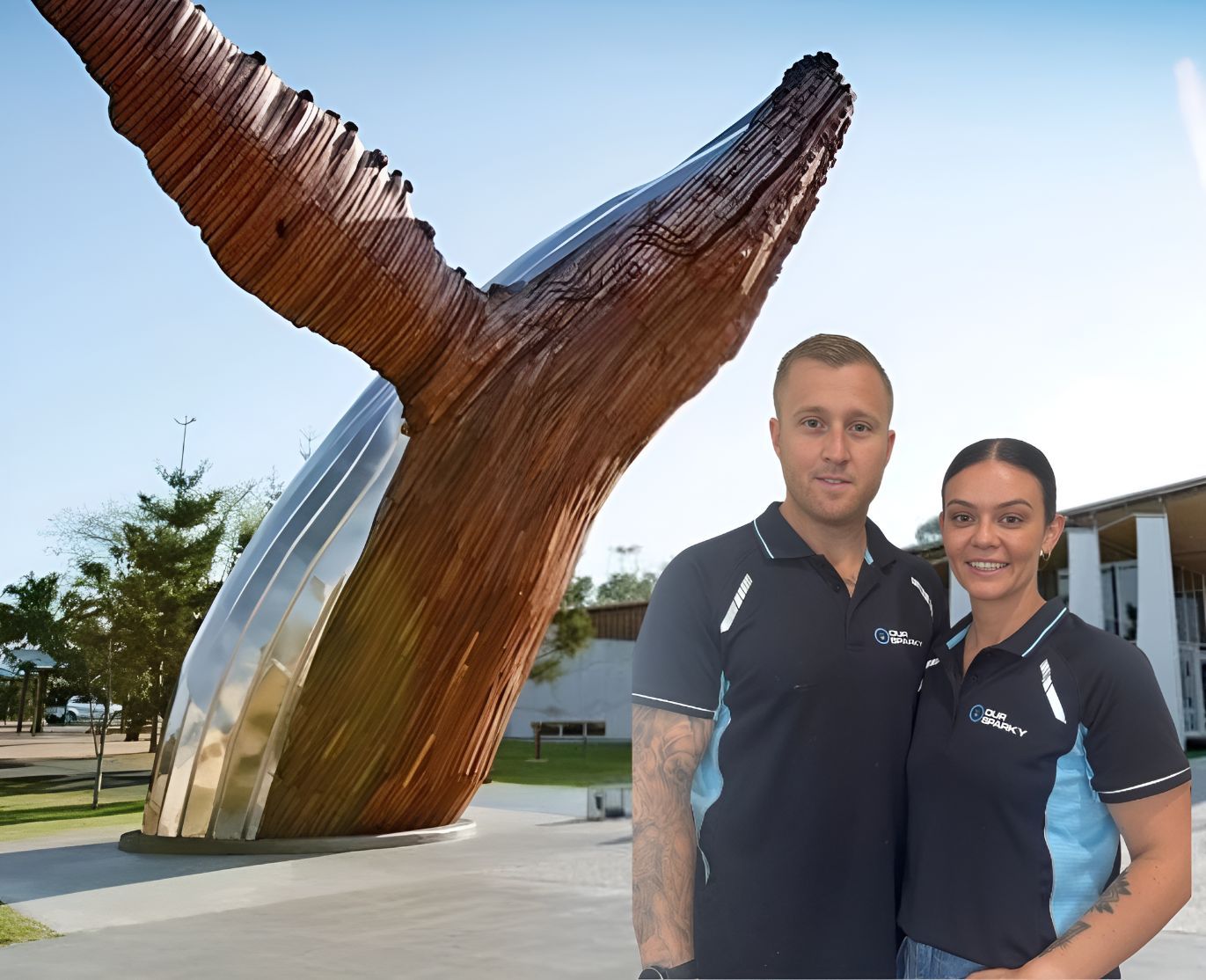 A Man and a Woman Standing in Front of a Whale Statue — Our Sparky In Urraween, QLD
