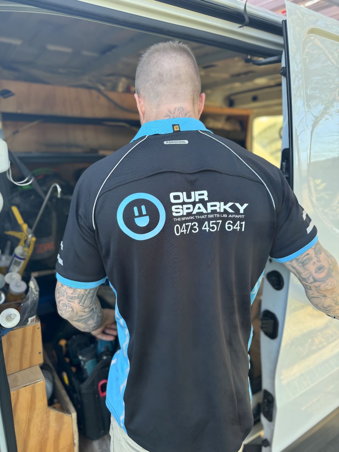 A man wearing a shirt that says our sparky on it — Our Sparky In Urraween, QLD