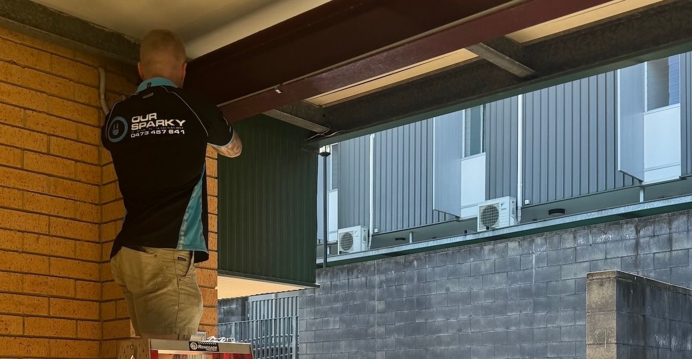 A ladder is sitting next to a box of ceiling fans. — Our Sparky In Urraween, QLD