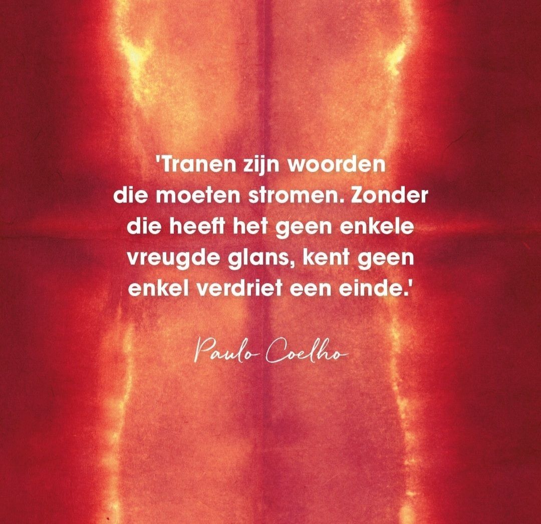 A quote from paulo coelho is on a red fire background