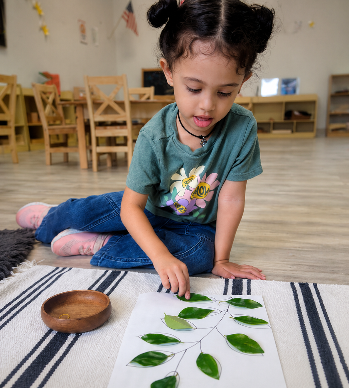 Montessori preschool activity in Austin with child matching leaves in hands-on learning environment