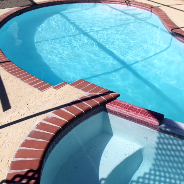 Clean Swimming Pool with Red Tiles — Bradenton, FL — Doug's Pool Service
