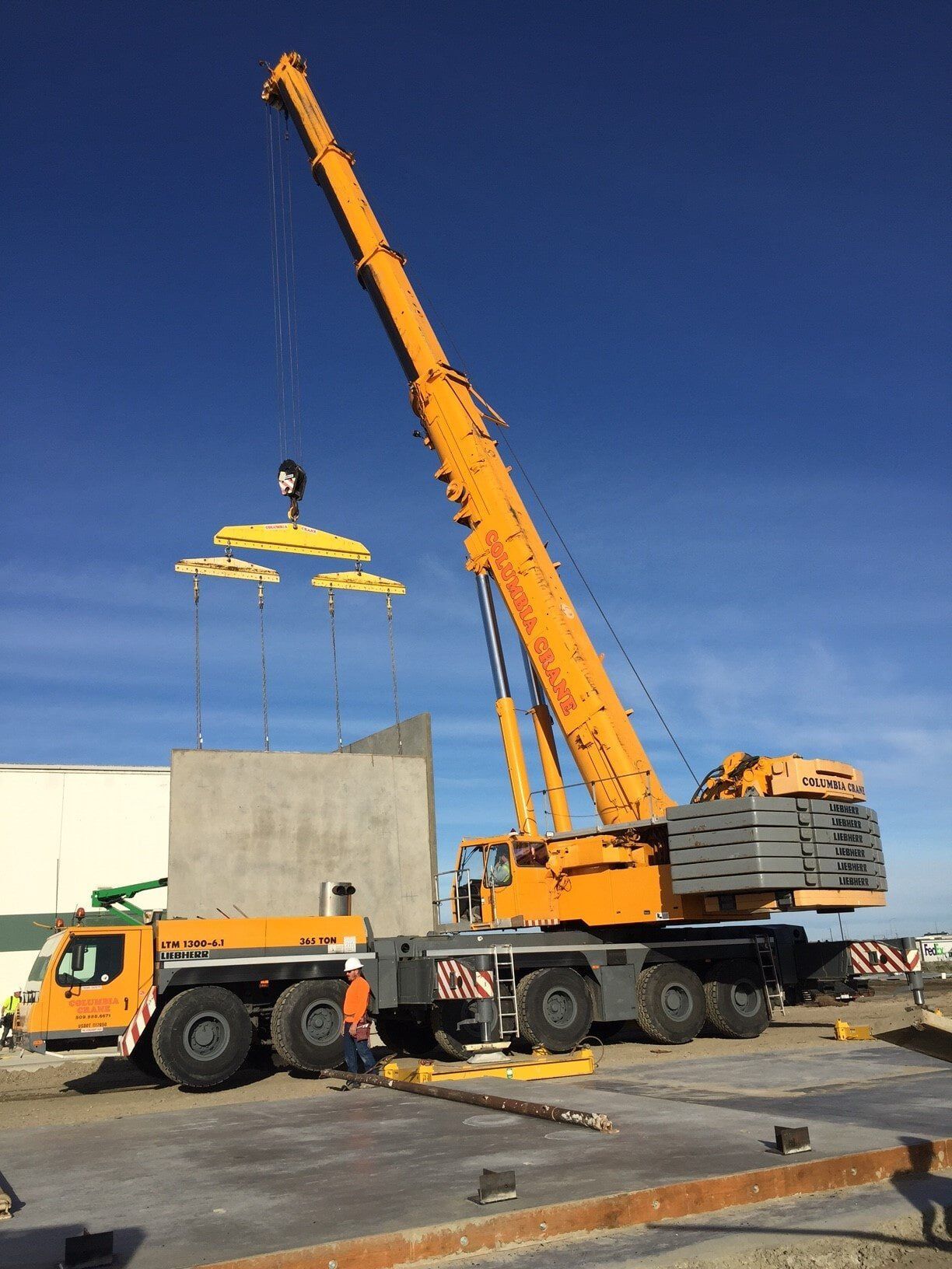 Mobile crane with its boom risen outdoors — Hoisting Equipment in Wenatchee, Washington