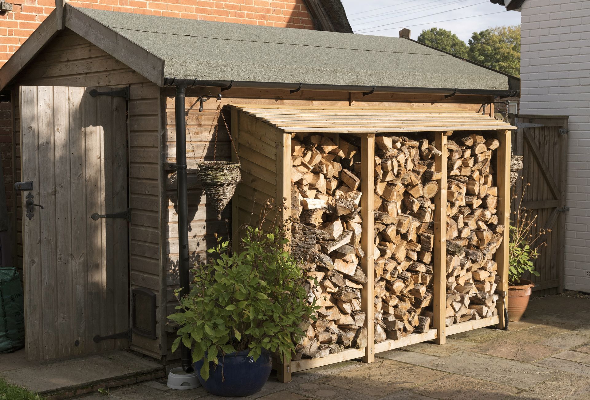 Wooden shed with firewood storage