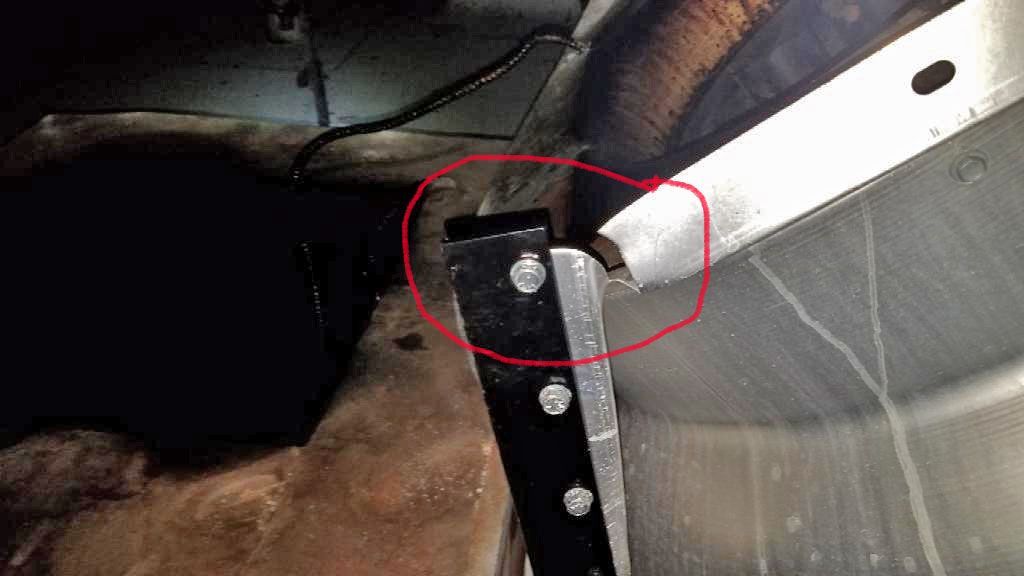 A close up of a metal object with a red circle around it.