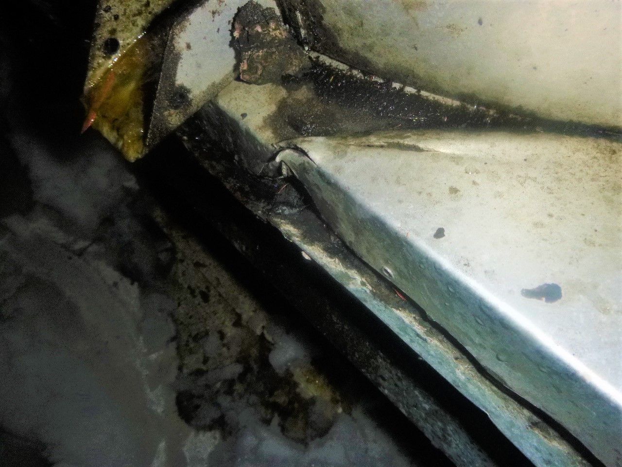 A close up of a piece of metal with rust on it.