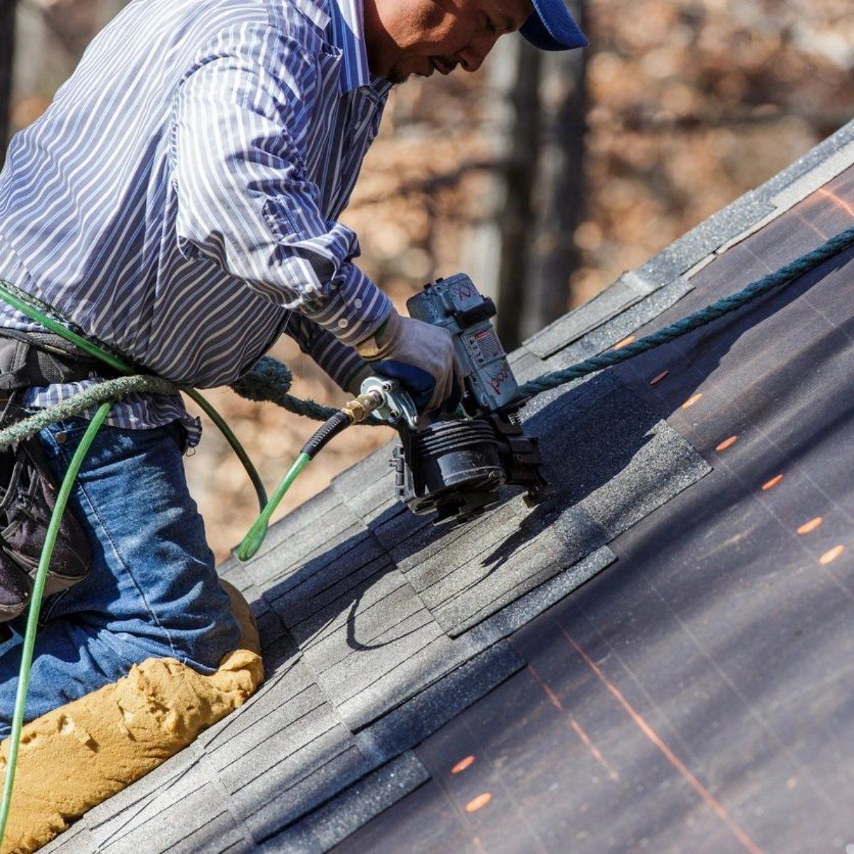 Professional worker repairing roof — Corpus Christi, TX — Gill Roofing Co Inc