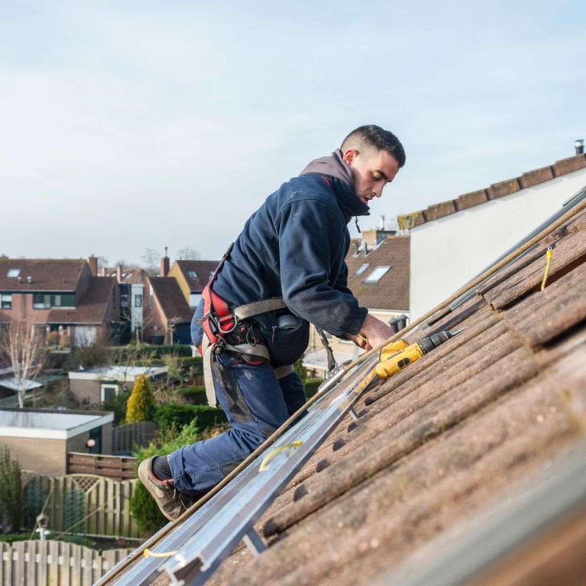 Professional worker installing roof — Corpus Christi, TX — Gill Roofing Co Inc