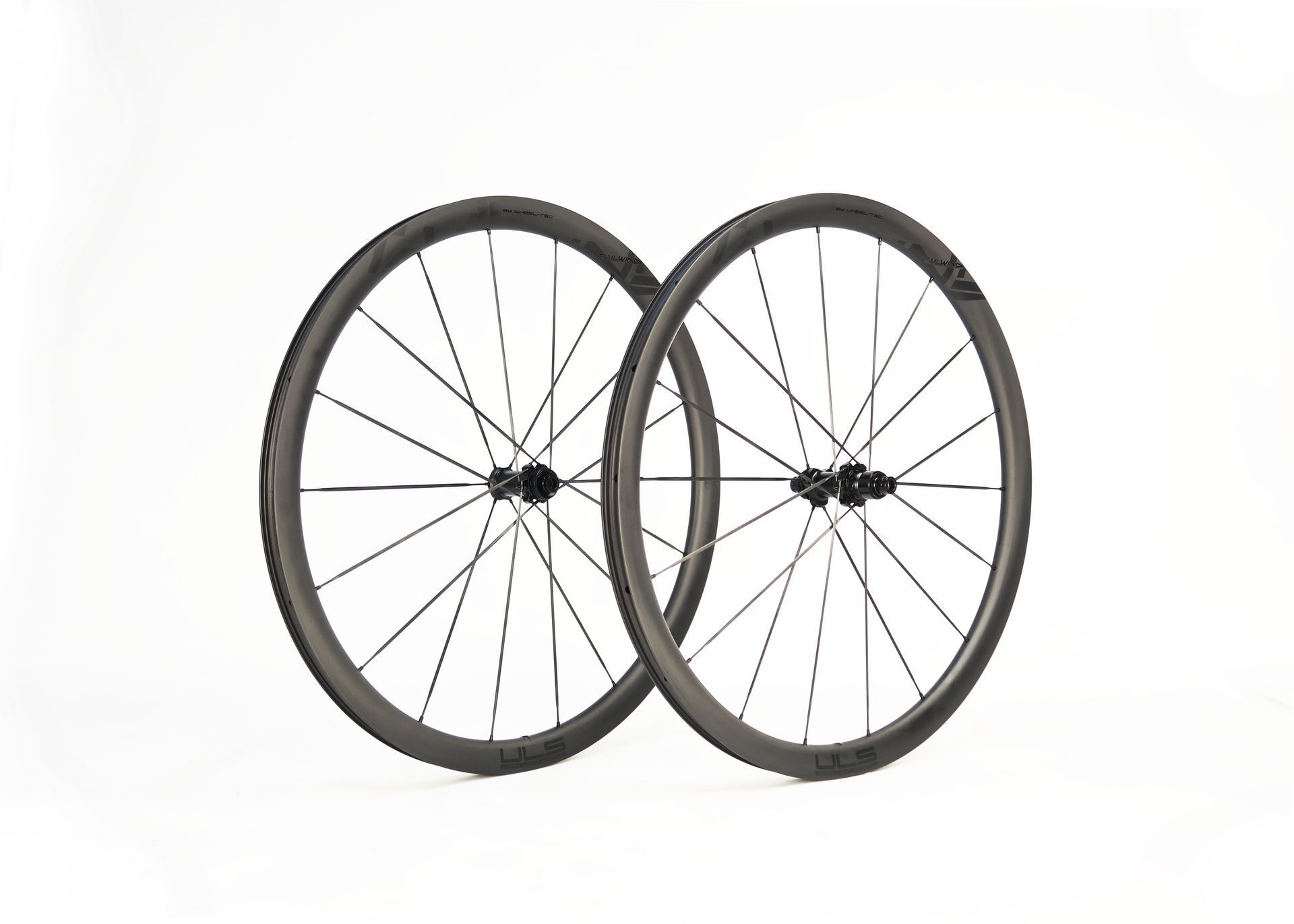 A close up of an aero carbon Tailwind bicycle wheel with logo