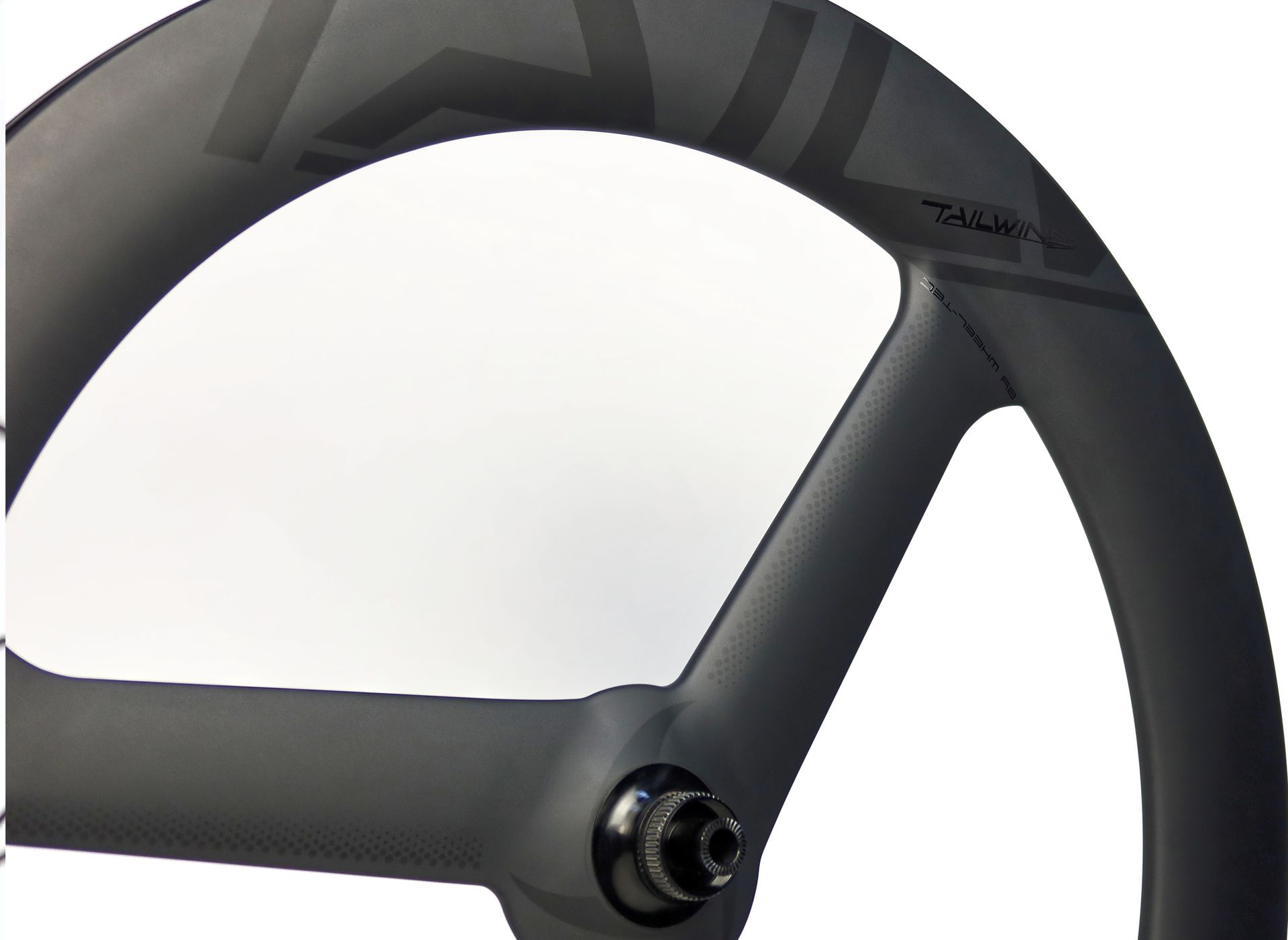 A close up of a carbon trispoke bicycle wheel for time trial and triathlon