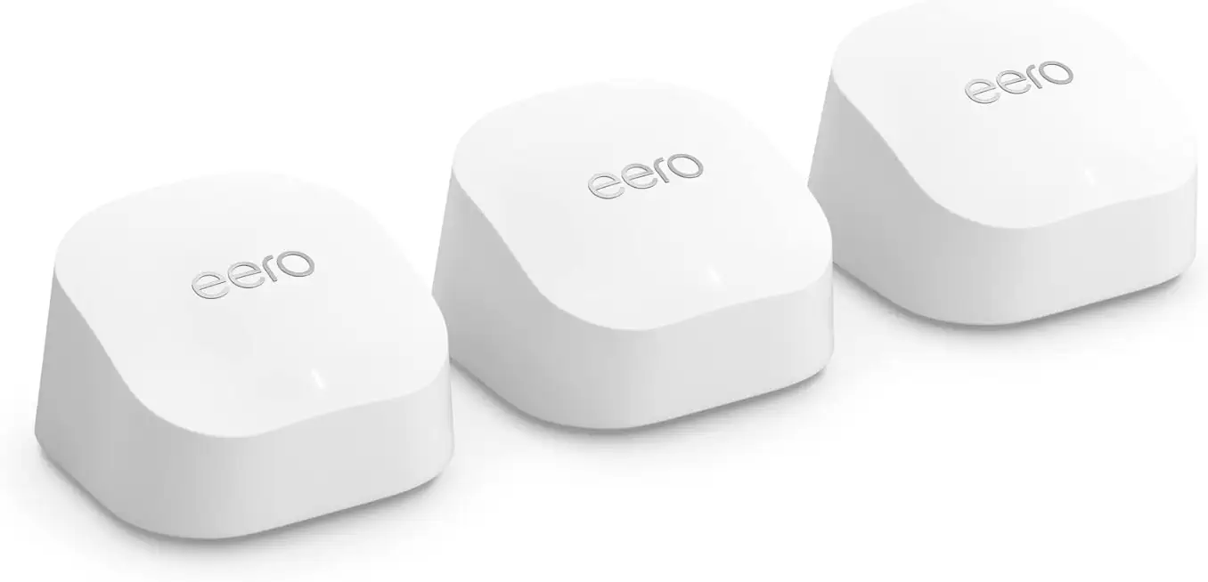 Three white Eero Wi-Fi mesh network devices. Each has the "eero" logo and a rounded, square shape.