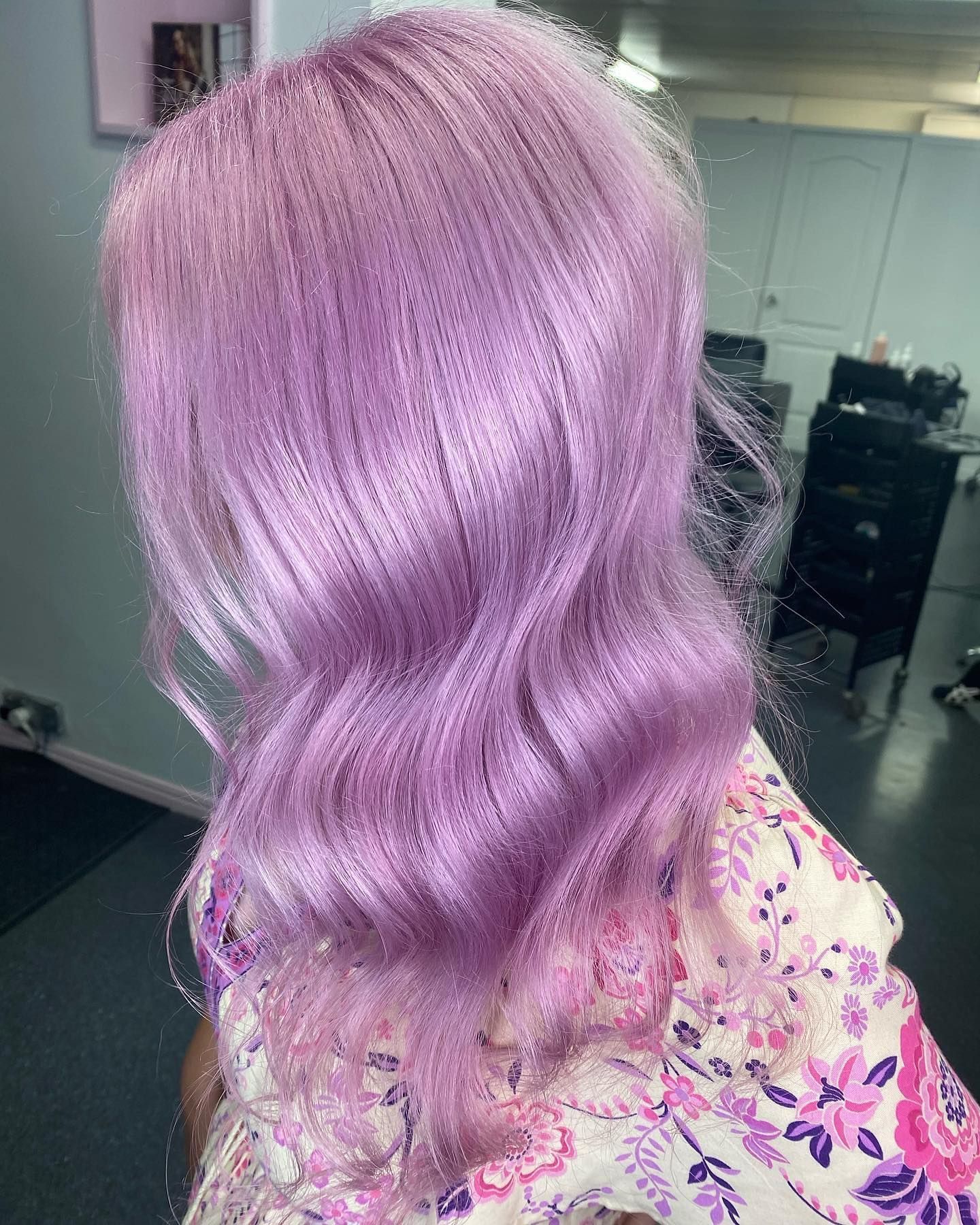 A woman with purple hair is wearing a floral shirt. — Mysa on Flinders In Townsville City, QLD