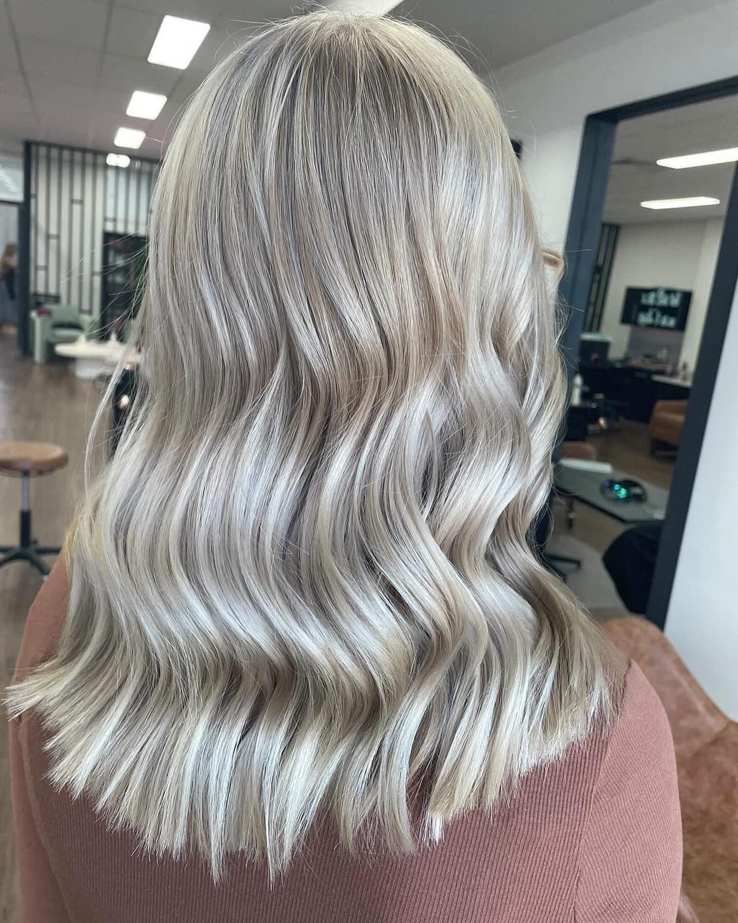 A woman with blonde hair is sitting in a salon. — Mysa on Flinders In Townsville City, QLD