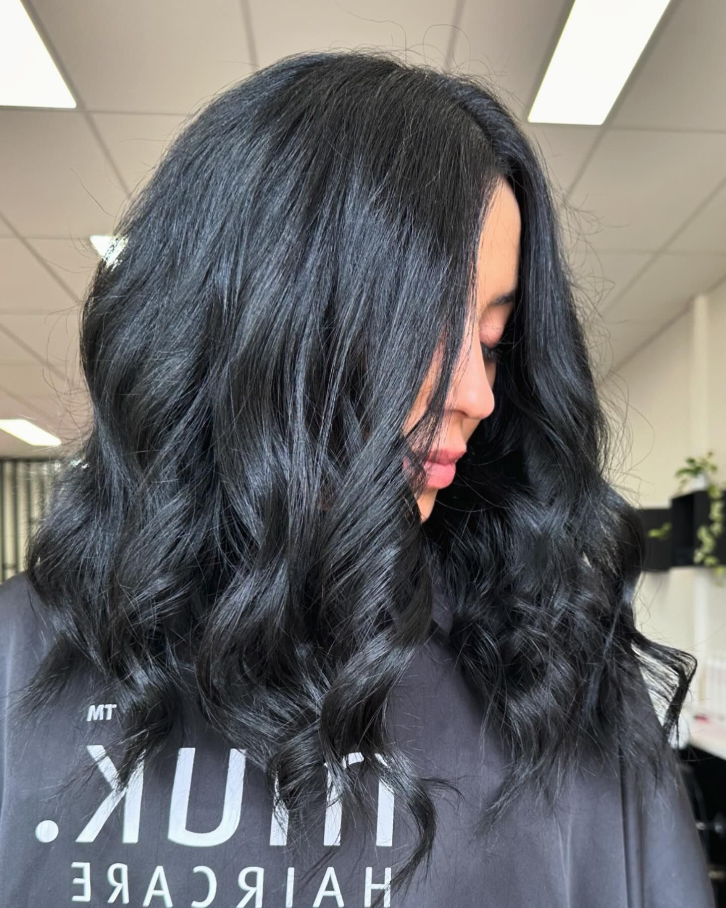 A woman with long black hair is wearing a black shirt. — Mysa on Flinders In Townsville City, QLD