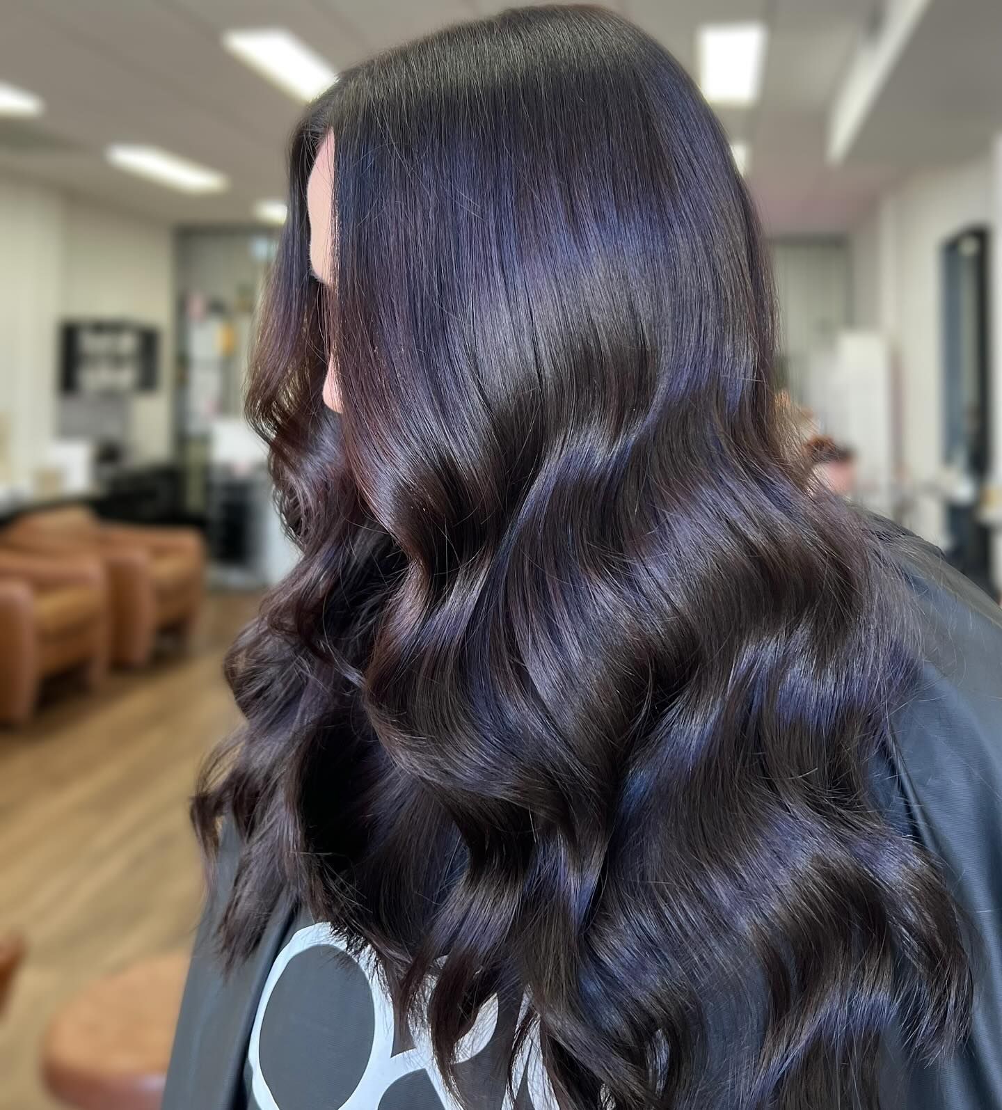 A woman with long dark hair is standing in a salon. — Mysa on Flinders In Townsville City, QLD