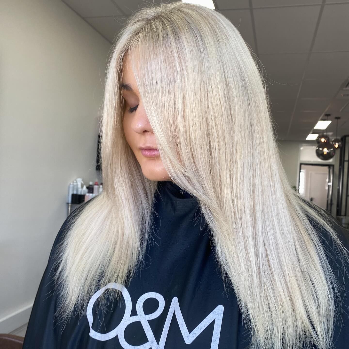 A woman with long blonde hair is wearing a black cape. — Mysa on Flinders In Townsville City, QLD