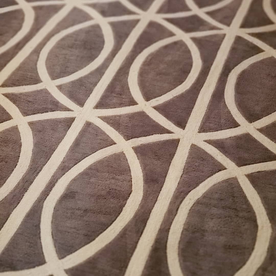 A close up of a rug with a geometric pattern