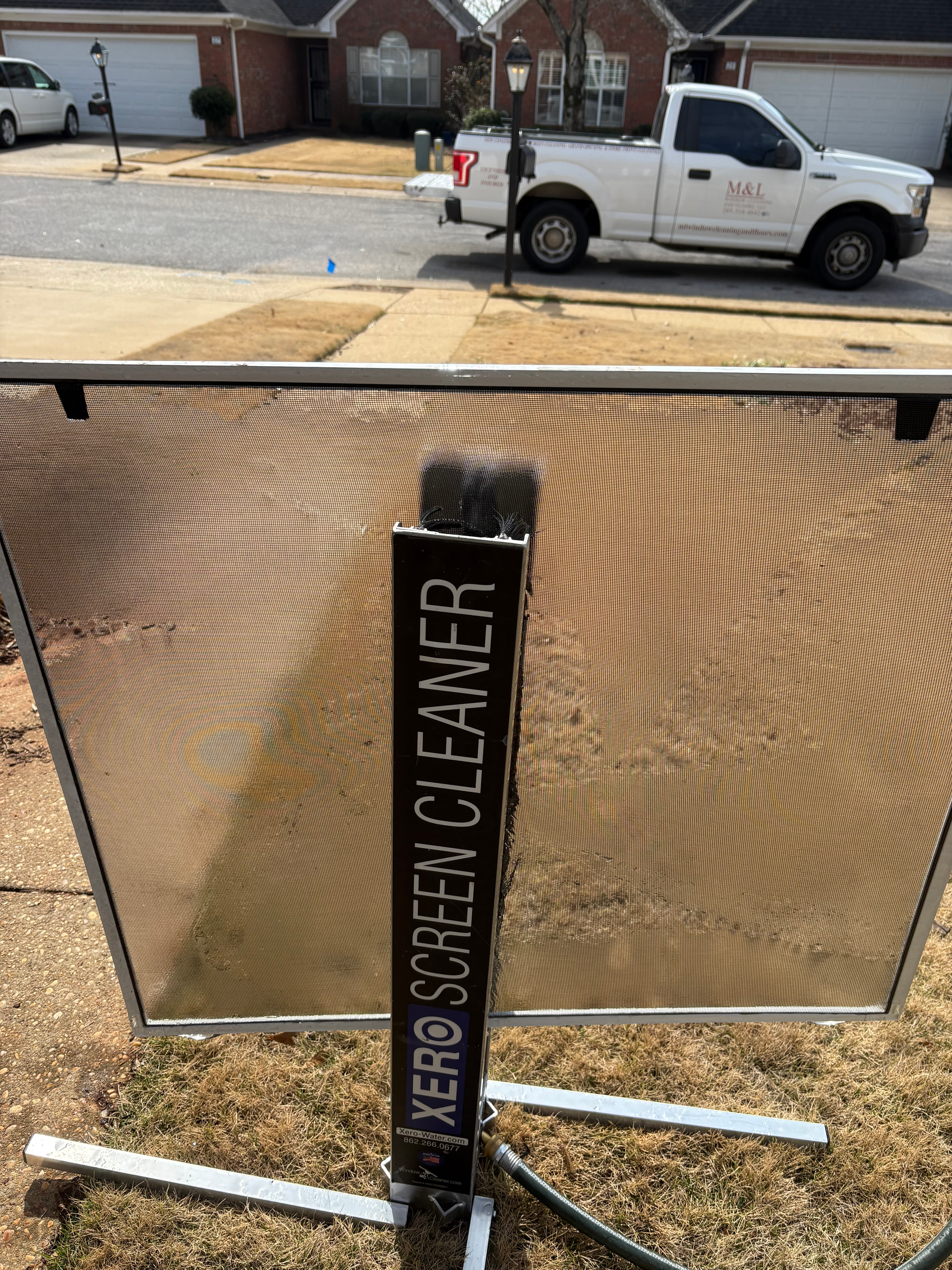 A screen cleaner with a sign that reads 