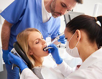 Woman is Getting Treatment in Dentist's Office — Empire, MI — Empire Family Dental